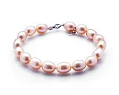 Браслет из розового рисообразного речного жемчуга. Жемчужины 7,5-8 мм